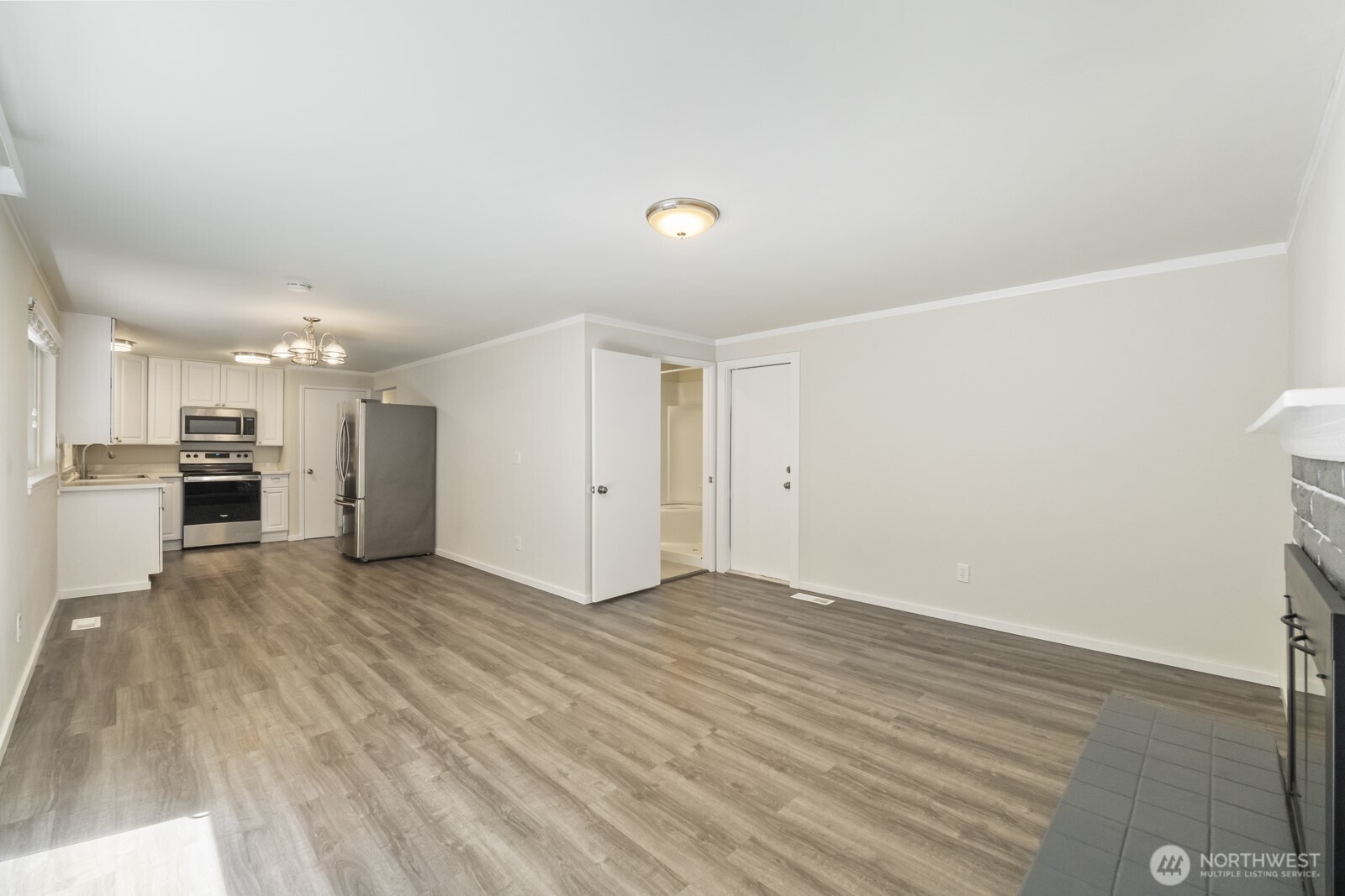 210 219th Place Southwest Bothell, WA 98021 - Photo 8 of 31 a view of empty room with wooden floor