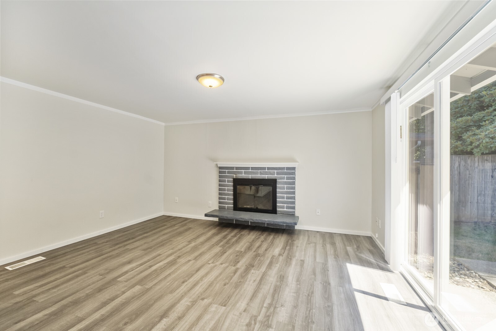 210 219th Place Southwest Bothell, WA 98021 - Photo 10 of 31 wooden floor in an empty room with a window