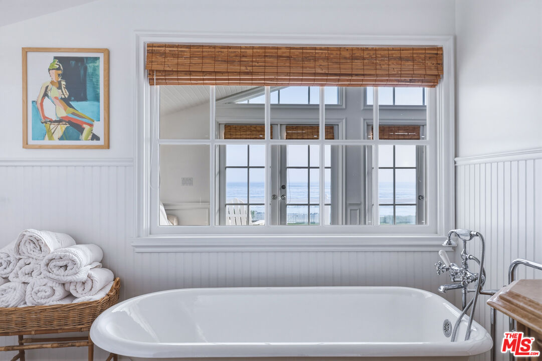 30810 Broad Beach Road Malibu, CA 90265 - Photo 38 of 55 a bathroom with a bathtub and window