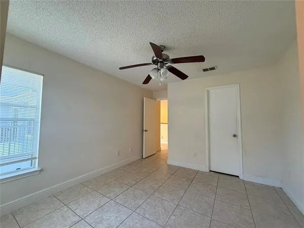 a view of room with a ceiling fan