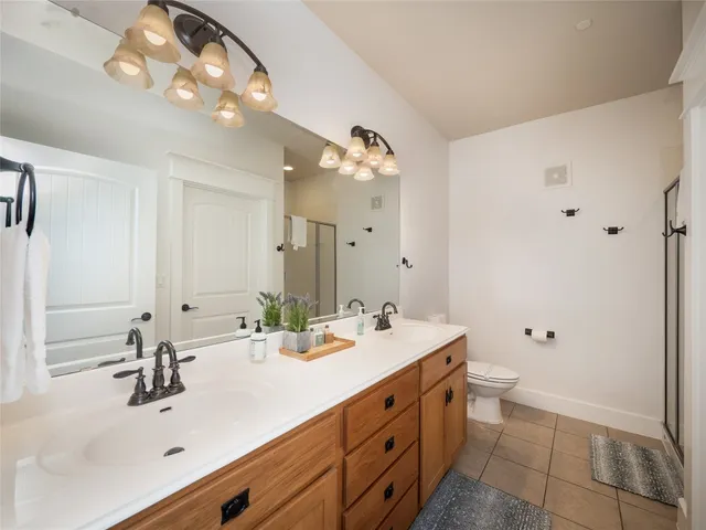 a bathroom with a double vanity sink mirror and double