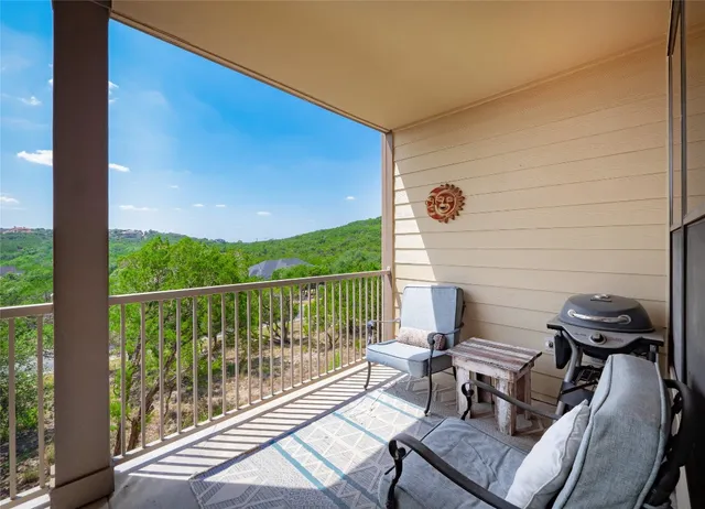 a view of a balcony with furniture