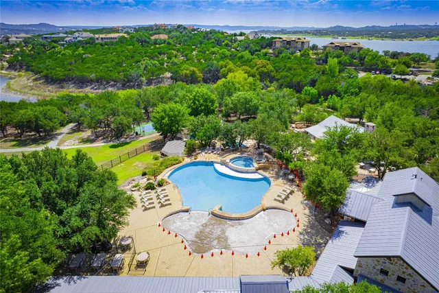 an aerial view of a house with yard and outdoor seating