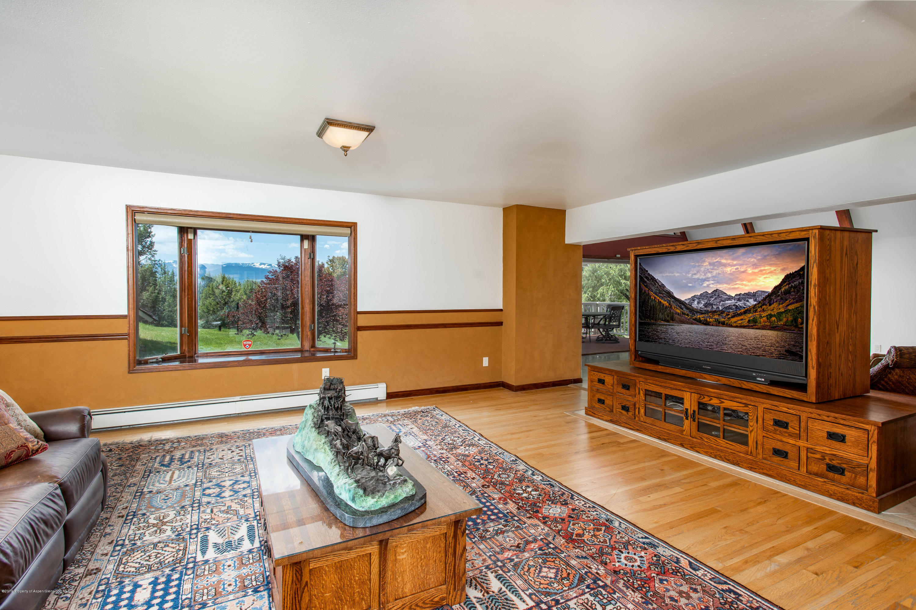362 Panoramic Drive Silt, CO 81652 - Photo 11 of 43 a living room with furniture and a flat screen tv