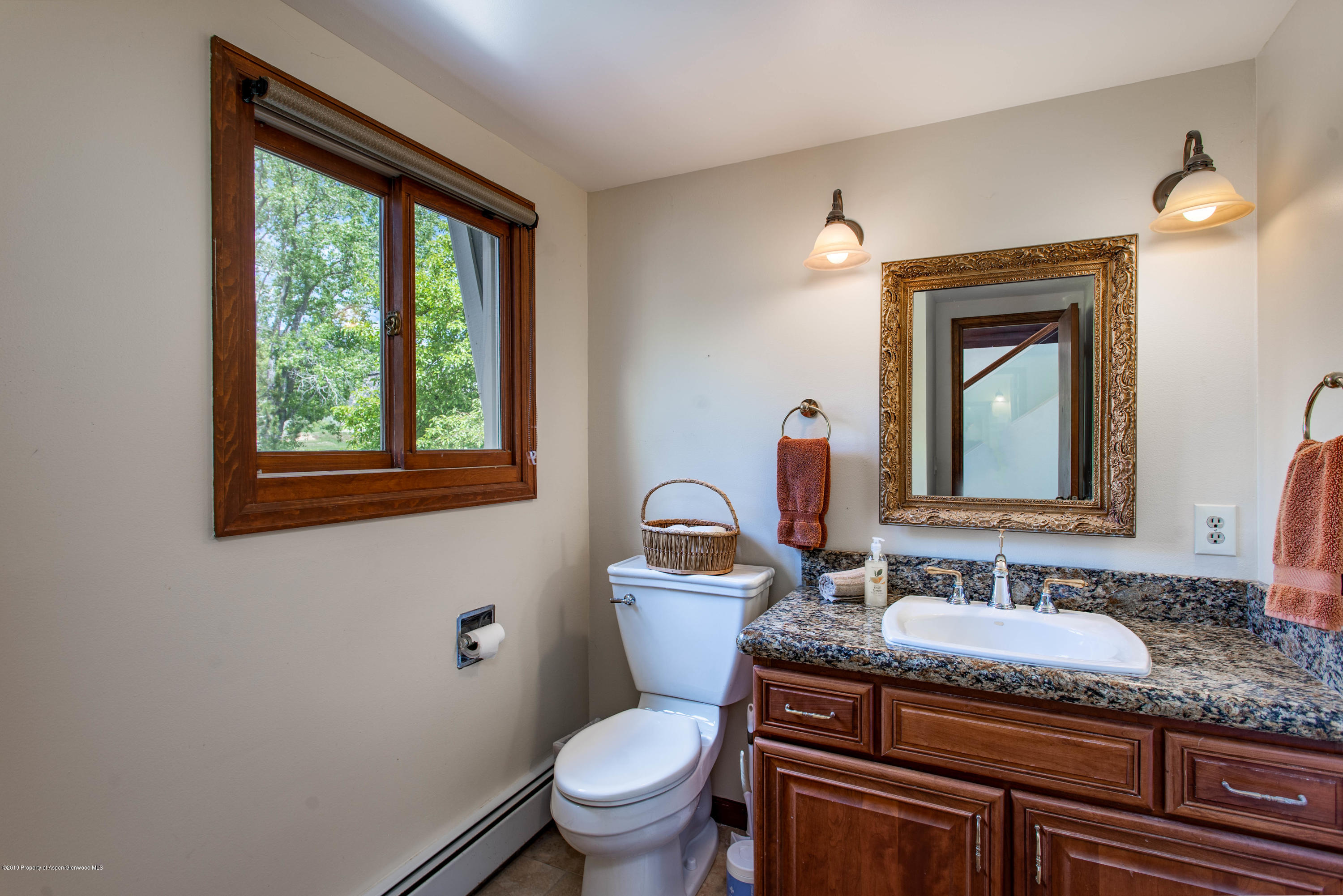 362 Panoramic Drive Silt, CO 81652 - Photo 15 of 43 a bathroom with a granite countertop sink a toilet and mirror