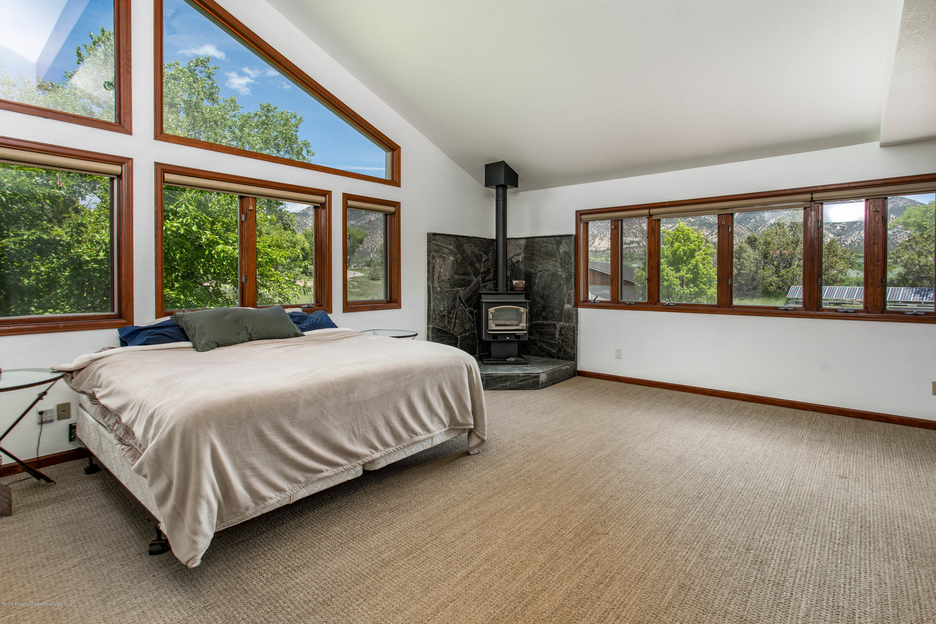 362 Panoramic Drive Silt, CO 81652 - Photo 20 of 43 a spacious bedroom with a bed and a large window