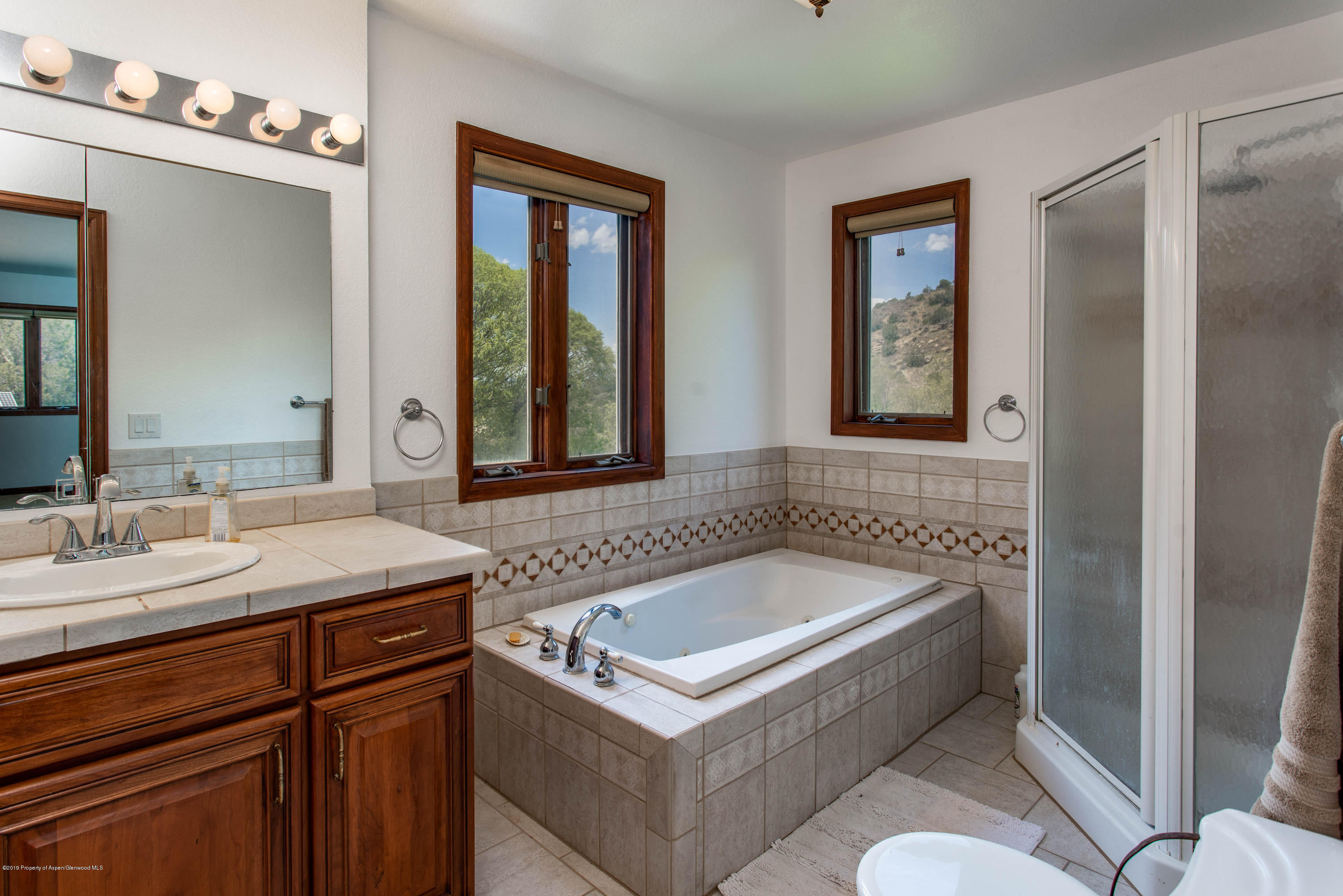 362 Panoramic Drive Silt, CO 81652 - Photo 22 of 43 a bathroom with a tub sink and mirror