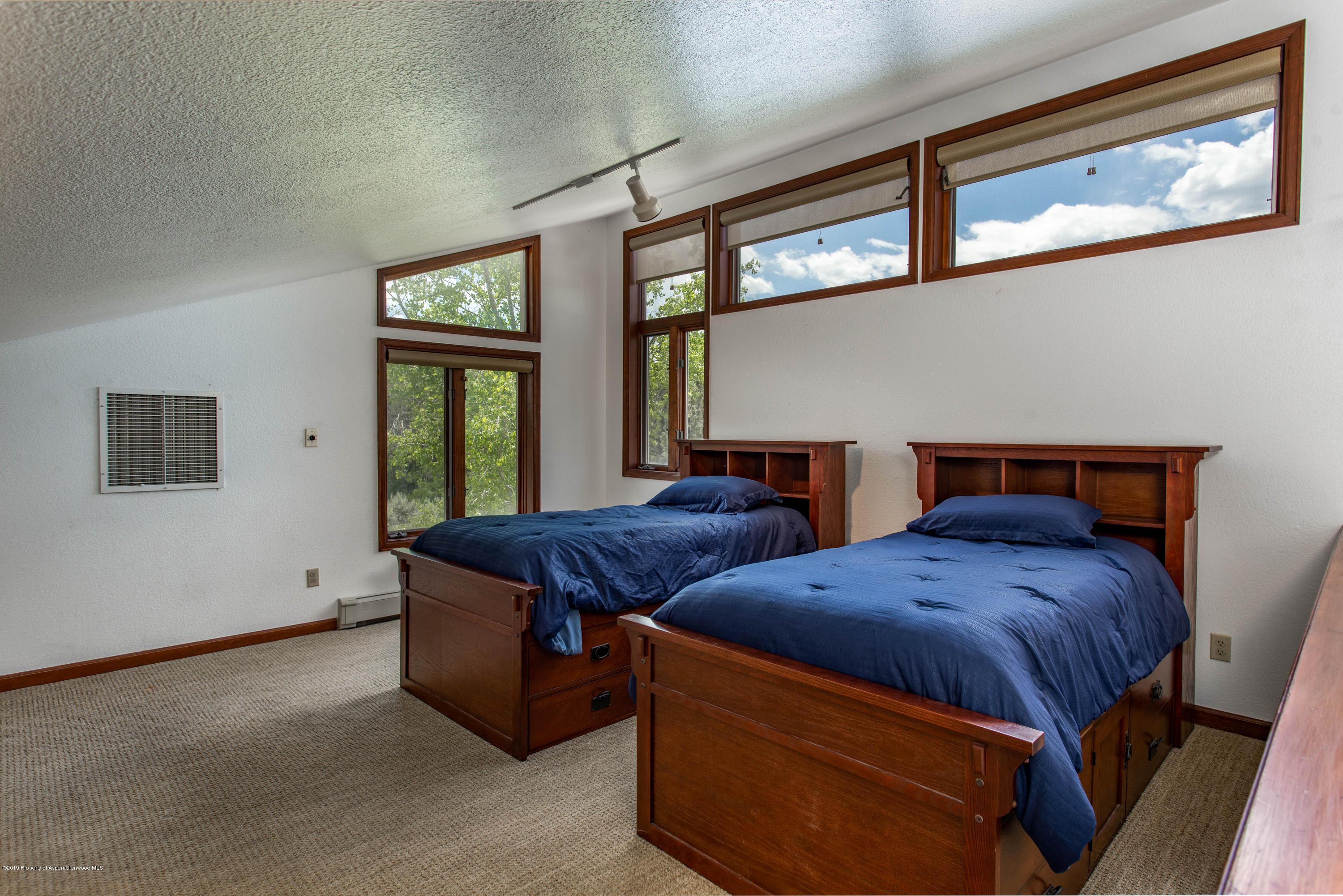 362 Panoramic Drive Silt, CO 81652 - Photo 27 of 43 a bedroom with two beds and windows