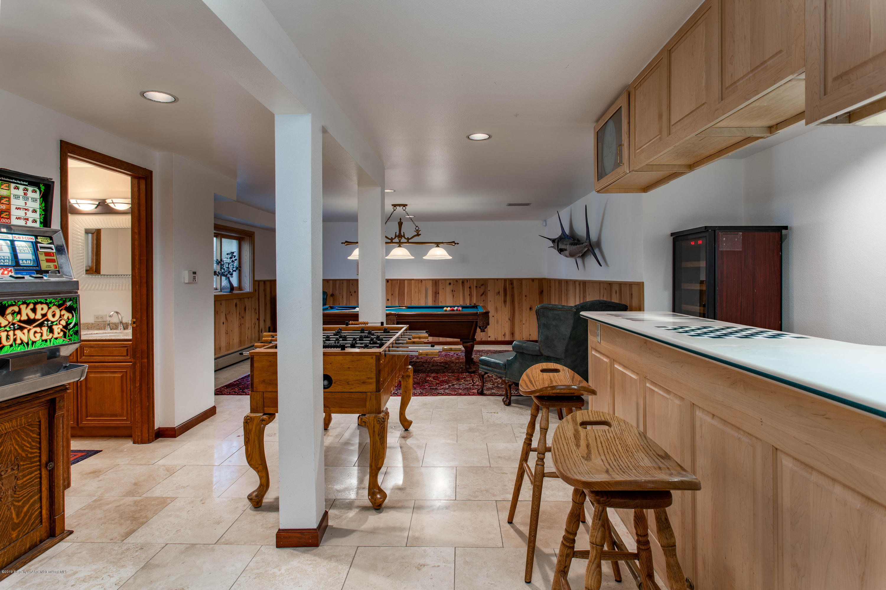 362 Panoramic Drive Silt, CO 81652 - Photo 29 of 43 a kitchen with stainless steel appliances kitchen island granite countertop a refrigerator and a stove top oven