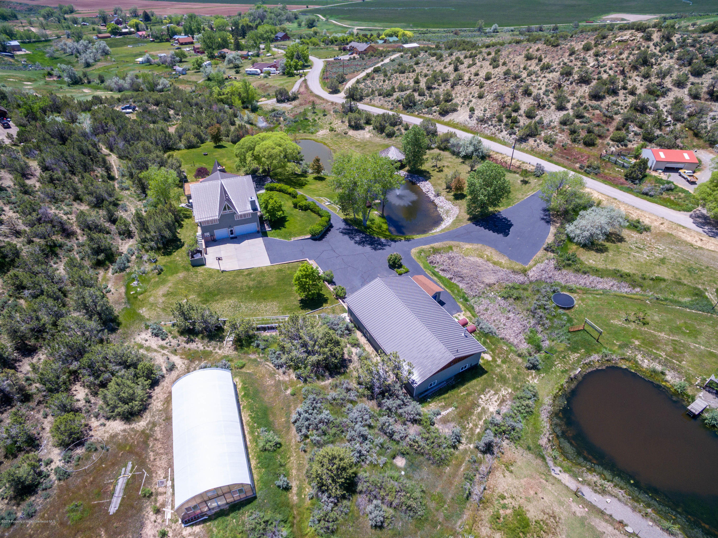 362 Panoramic Drive Silt, CO 81652 - Photo 43 of 43 an aerial view of a house with a yard and lake view