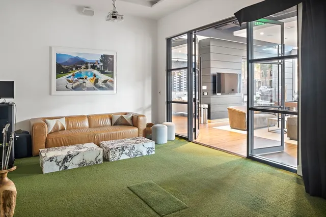 a spacious bedroom with a bed and a large window