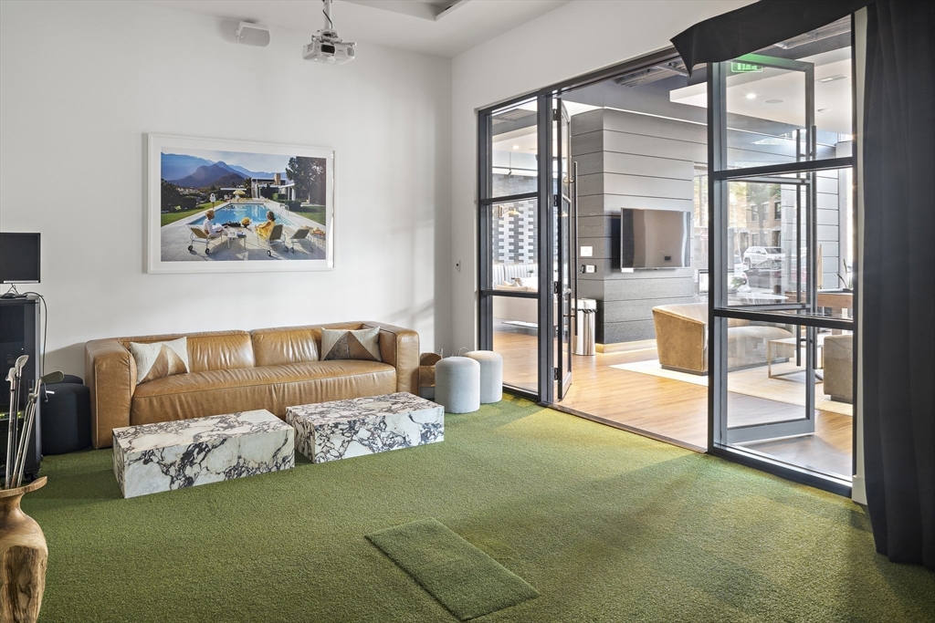 99 Sumner Street, Unit 413 Boston, MA 02128 - Photo 15 of 21 a spacious bedroom with a bed and a large window