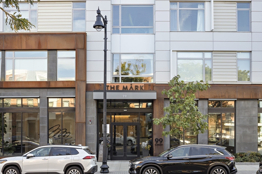 99 Sumner Street, Unit 413 Boston, MA 02128 - Photo 20 of 21 a car parked in front of a building