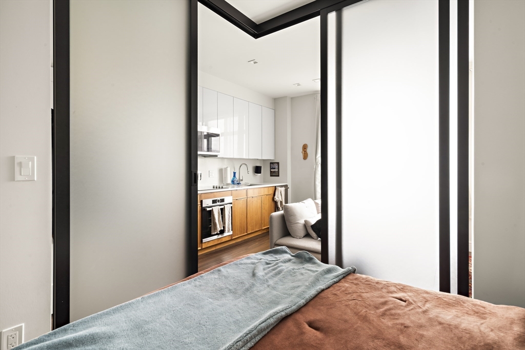 99 Sumner Street, Unit 413 Boston, MA 02128 - Photo 4 of 21 a view of kitchen and living room