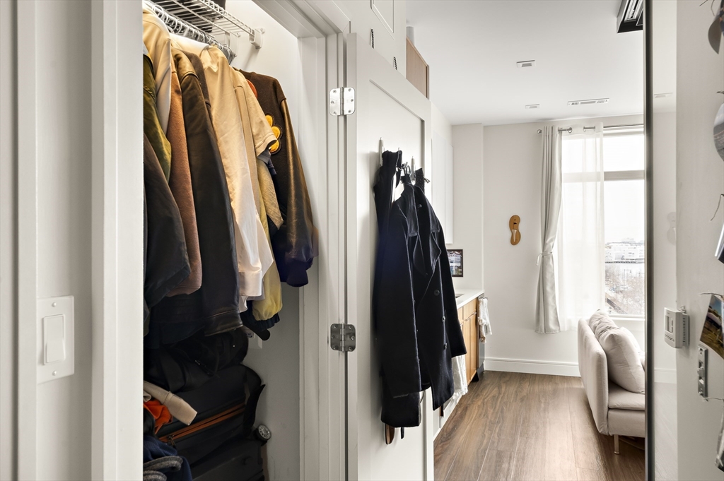 99 Sumner Street, Unit 413 Boston, MA 02128 - Photo 7 of 21 a view of walk in closet with clothes and shoes