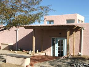 16955 South Lone Ranger Road Yucca, AZ 86438 - Photo 5 of 16 a view of a house with a street