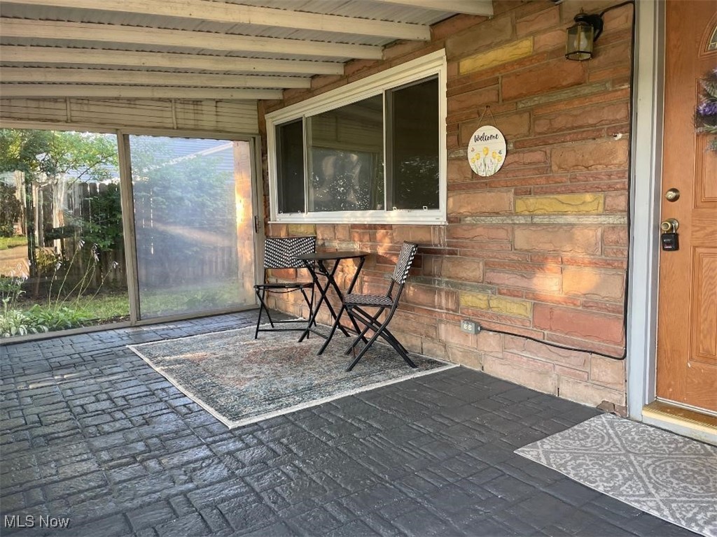 5741 Jaycox Road North Ridgeville, OH 44039 - Photo 4 of 23 Sunroom featuring beam ceiling
