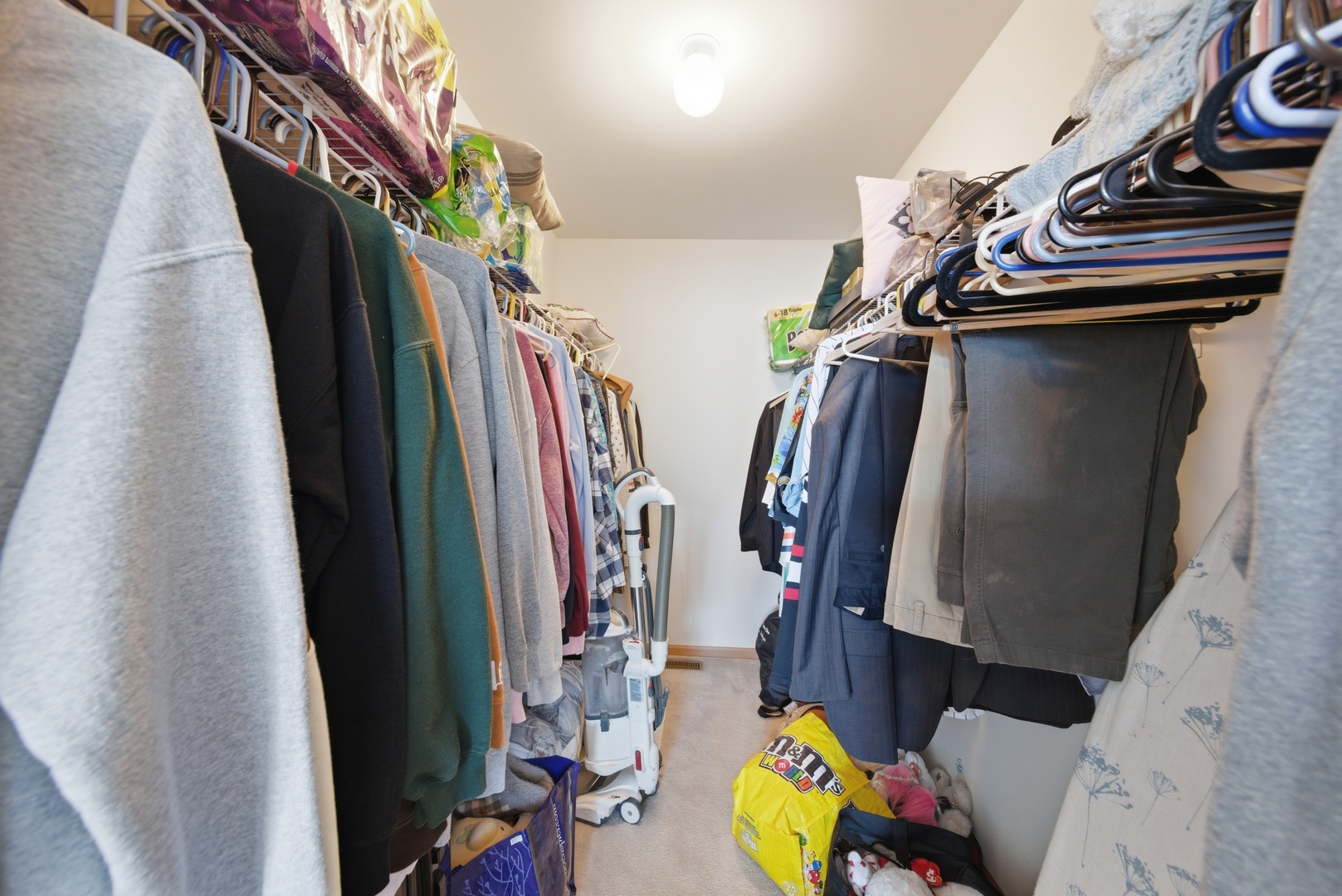 1758 Edith Lane Aurora, IL 60504 - Photo 17 of 23 a view of walk in closet with clothes and shoes