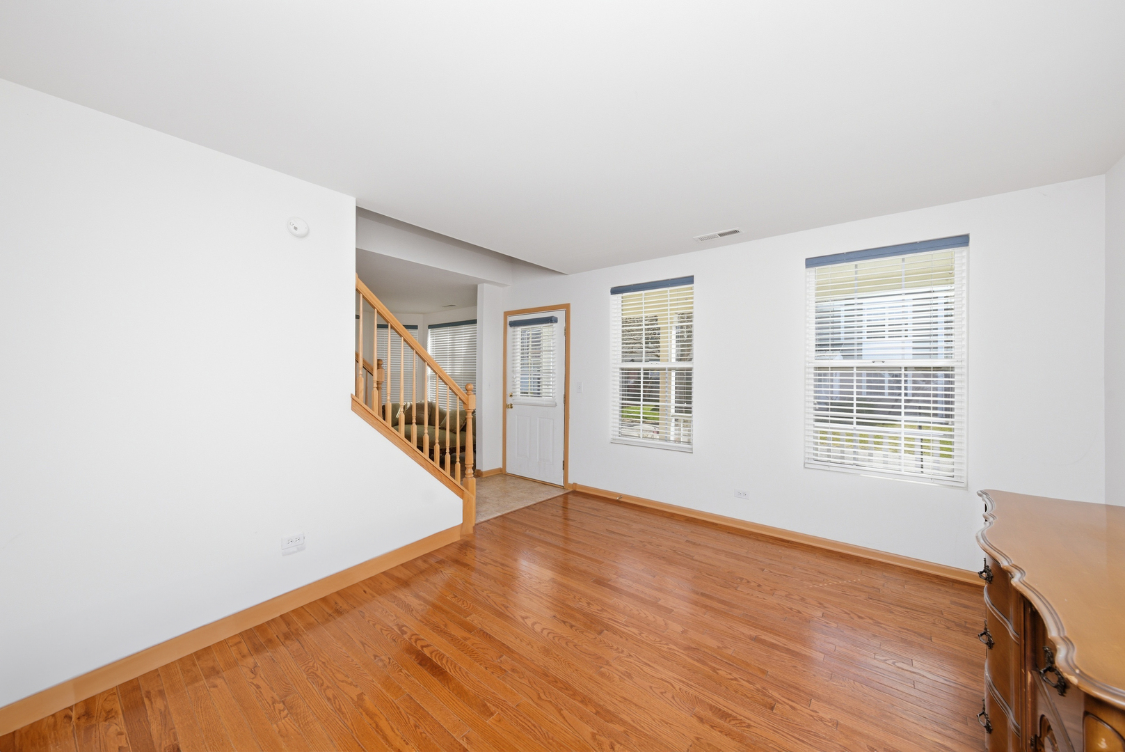 1758 Edith Lane Aurora, IL 60504 - Photo 10 of 23 a view of an empty room with wooden floor and a window