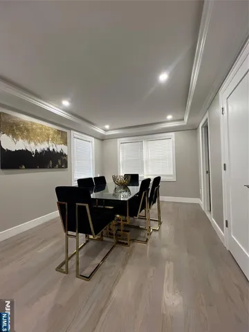 a view of a dining room with furniture and window