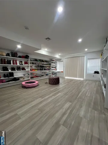 a room with lots of furniture and white walls