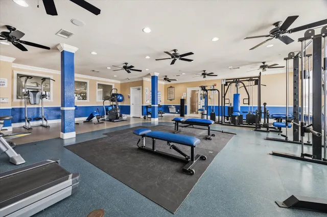 a living room with furniture kitchen view and a window
