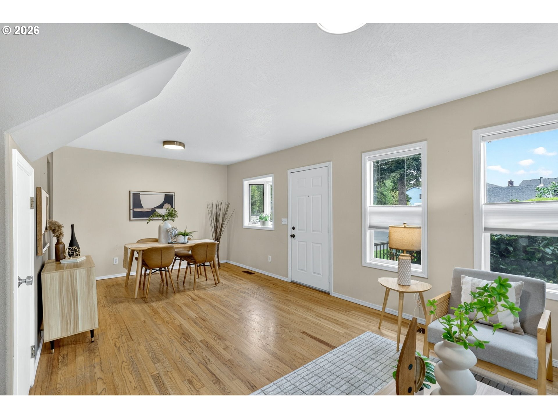 11824 Southeast Liebe Street Portland, OR 97266 - Photo 11 of 48 a living room with furniture and a wooden floor