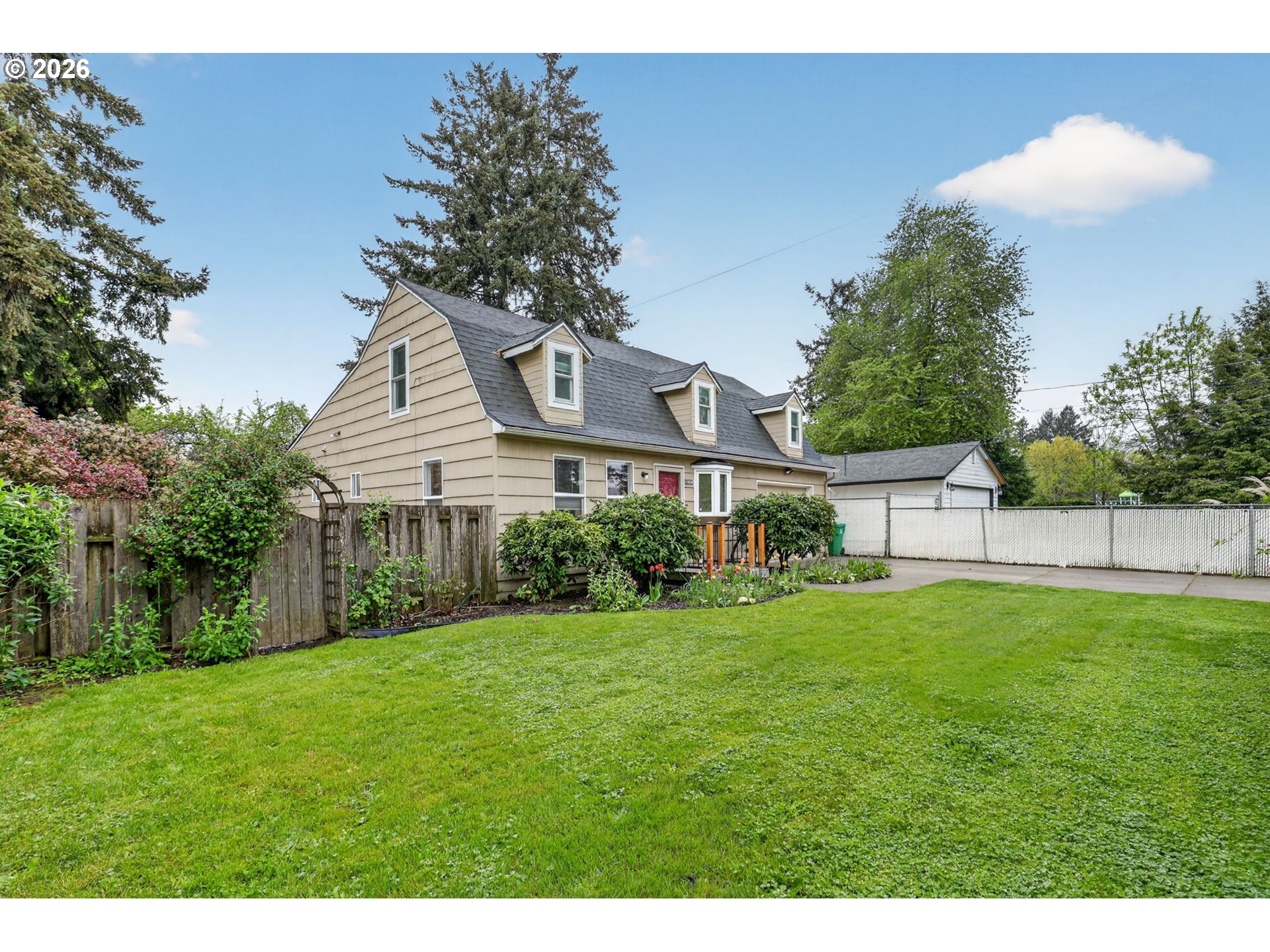 11824 Southeast Liebe Street Portland, OR 97266 - Photo 2 of 48 a view of a house with a backyard