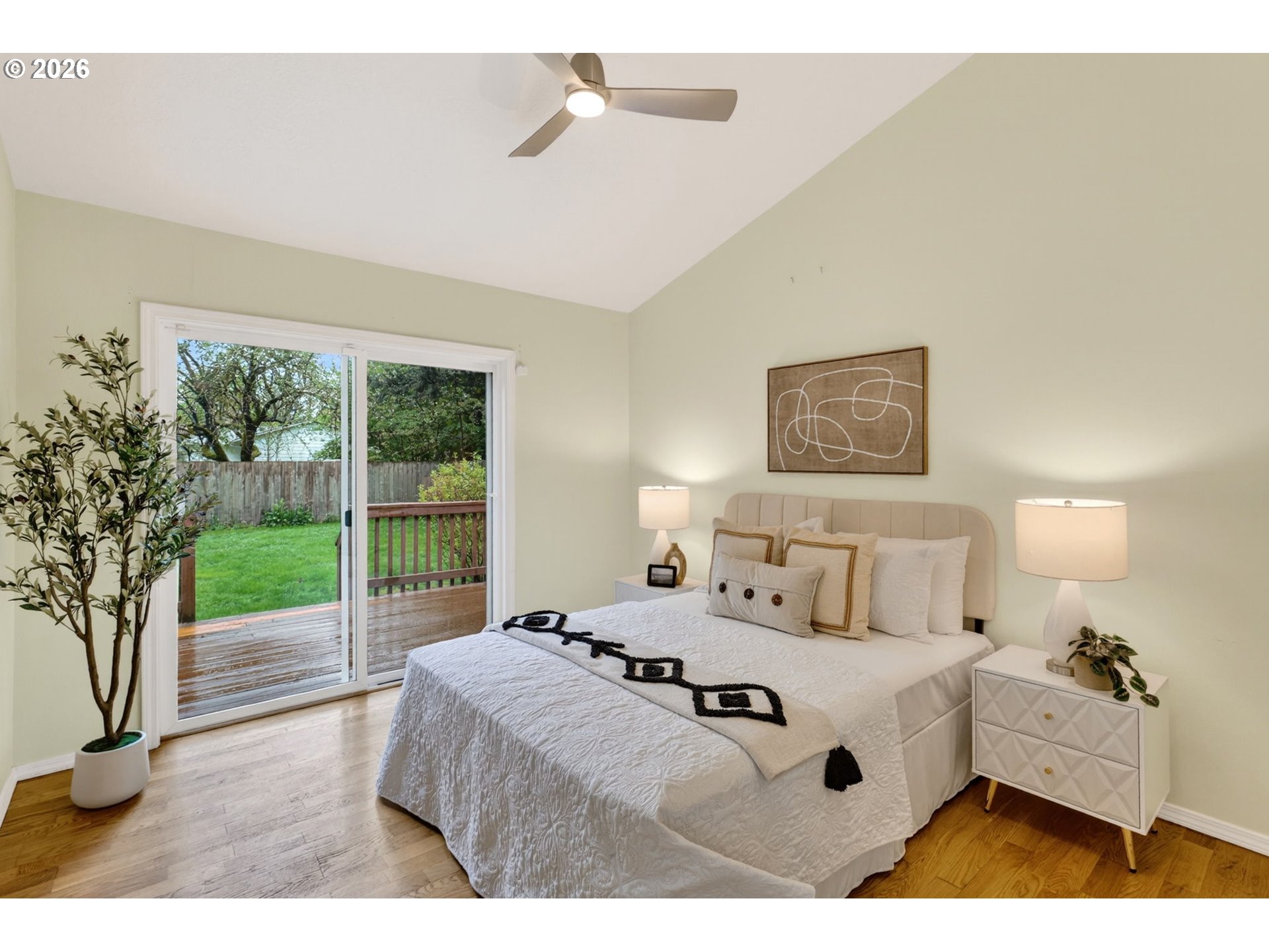 11824 Southeast Liebe Street Portland, OR 97266 - Photo 22 of 48 a bedroom with a bed and a large window