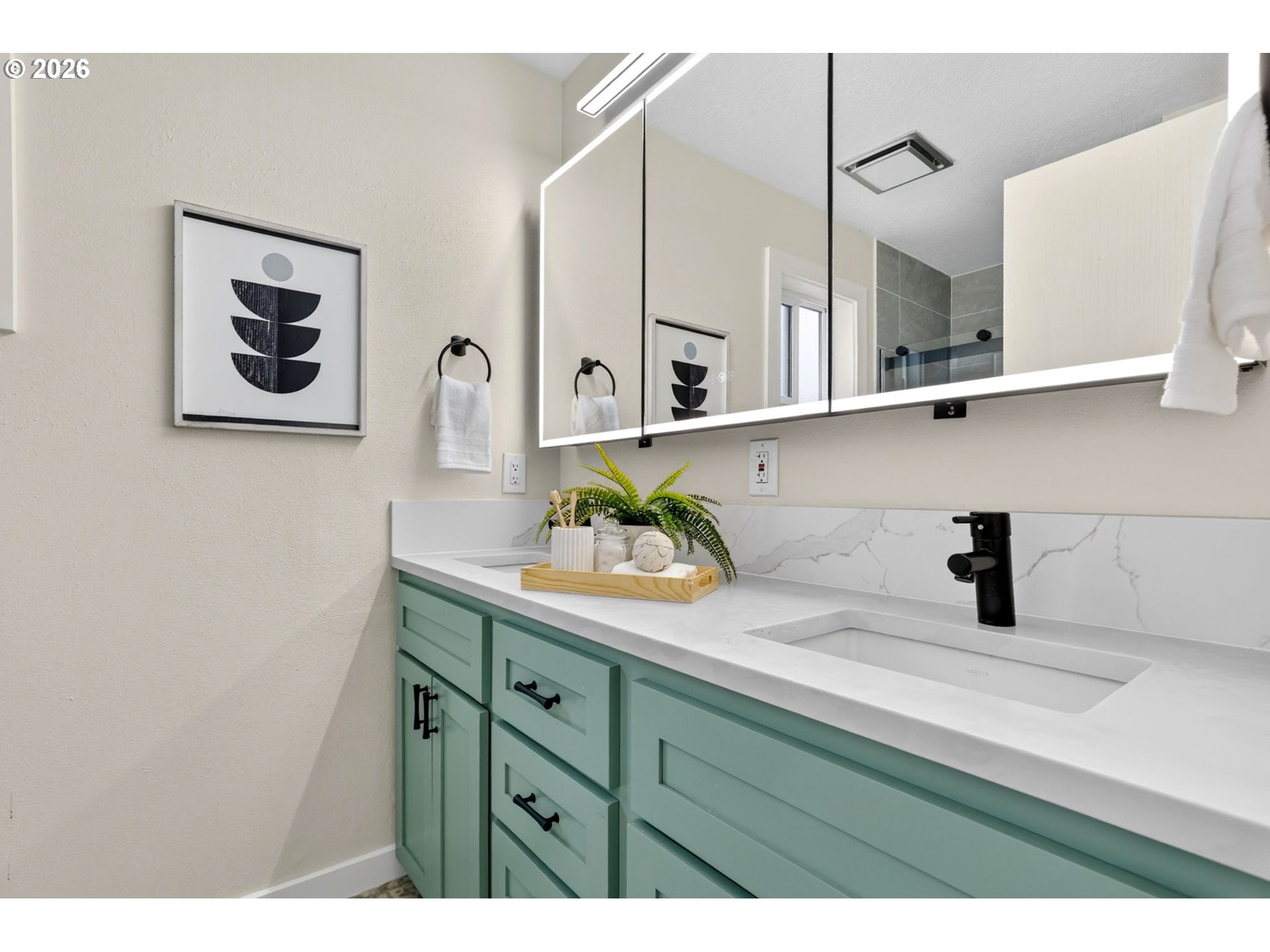11824 Southeast Liebe Street Portland, OR 97266 - Photo 24 of 48 a bathroom with a sink and a mirror