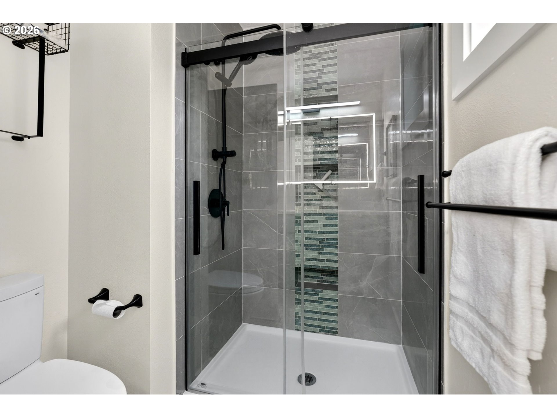 11824 Southeast Liebe Street Portland, OR 97266 - Photo 25 of 48 a bathroom with a shower