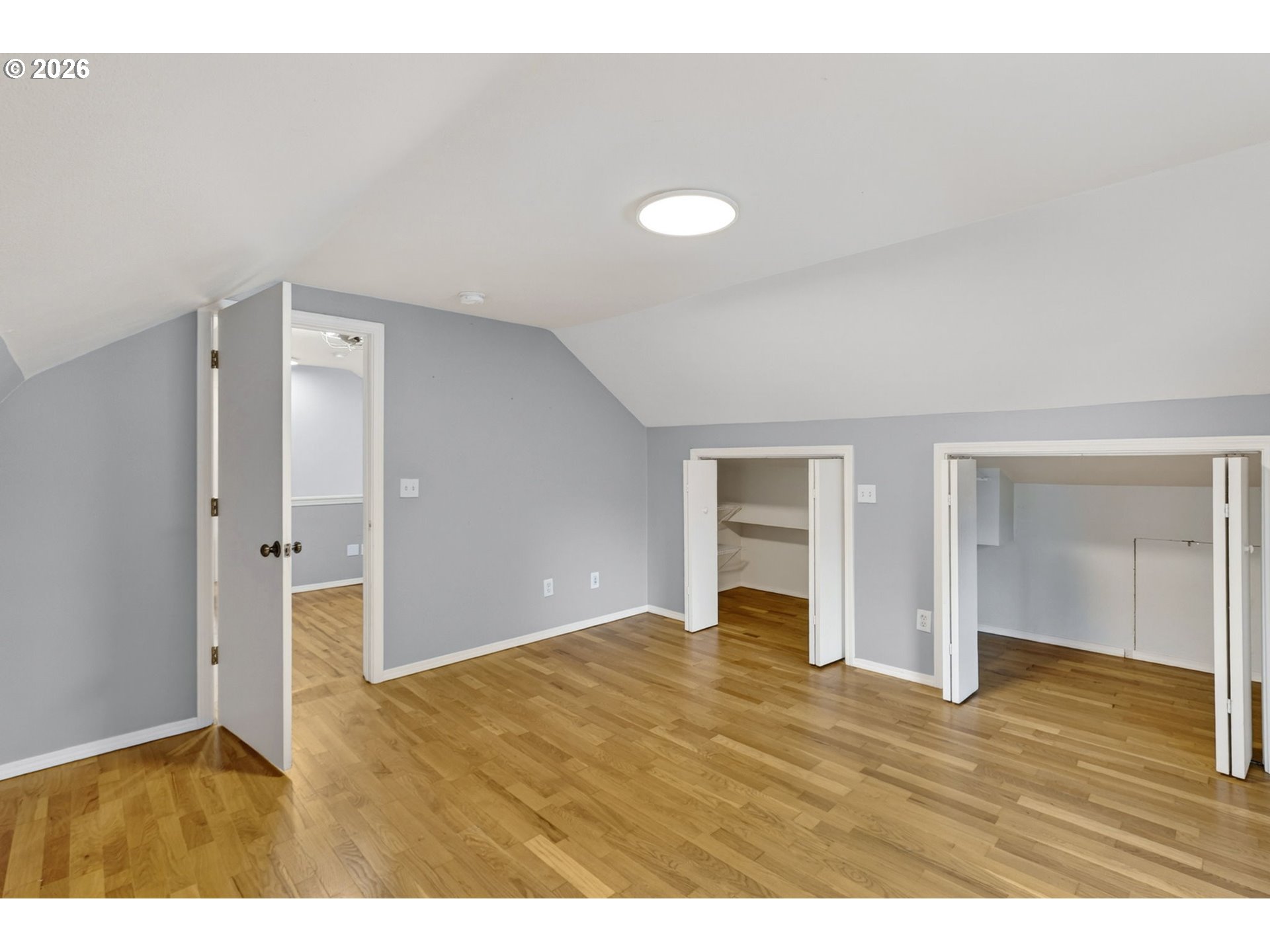 11824 Southeast Liebe Street Portland, OR 97266 - Photo 37 of 48 a view of an empty room with wooden floor and closet