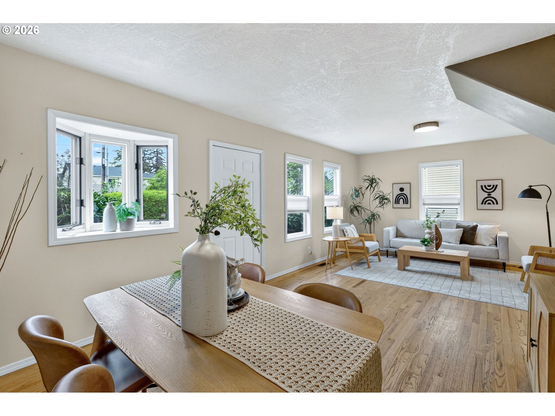 11824 Southeast Liebe Street Portland, OR 97266 - Photo 6 of 48 a living room with furniture and a potted plant