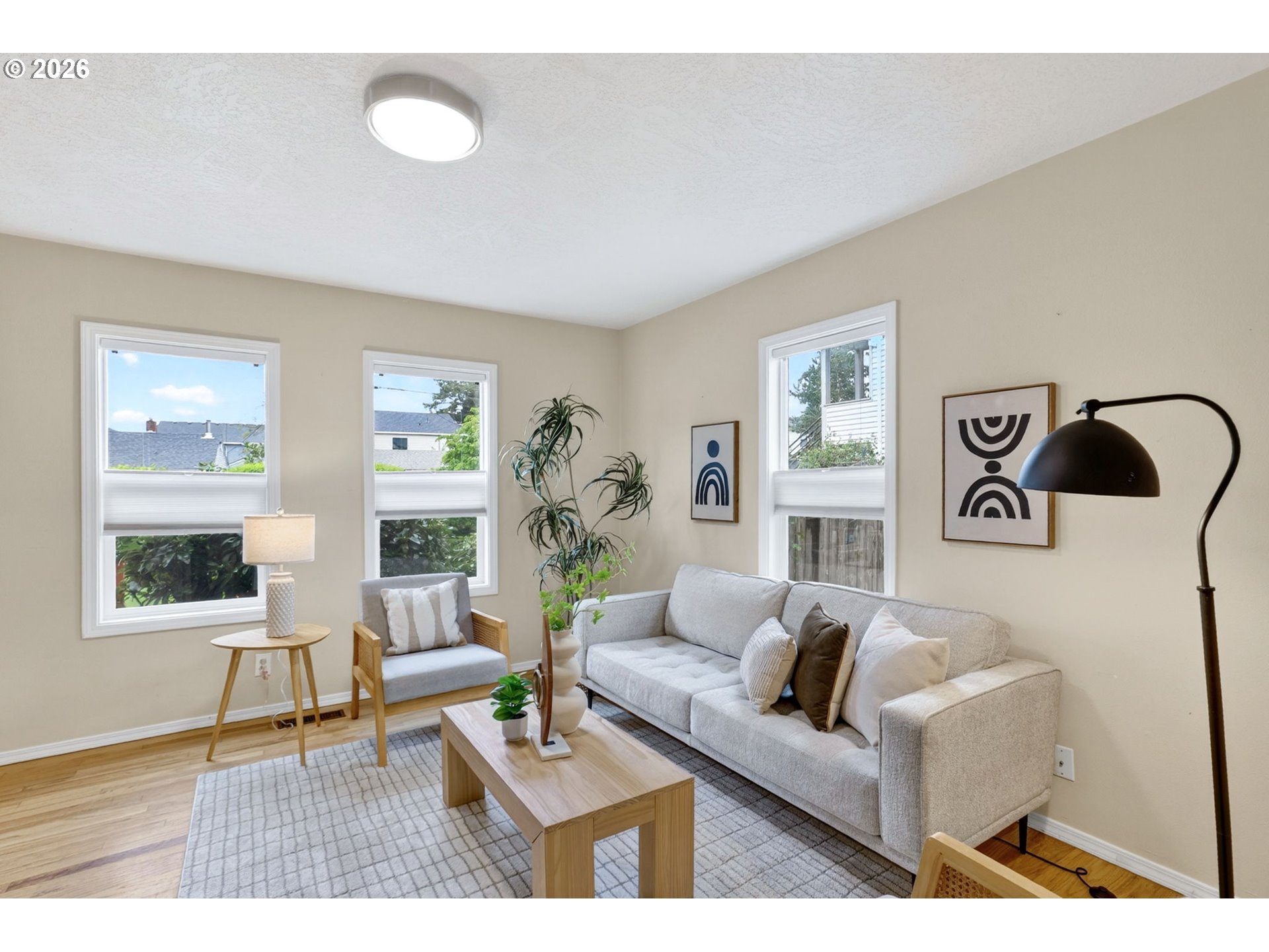 11824 Southeast Liebe Street Portland, OR 97266 - Photo 10 of 48 a living room with furniture and wooden floor