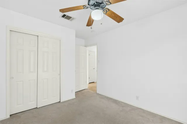 a view of small space with a ceiling fan