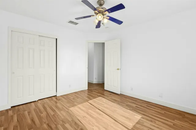 a view of a room with a ceiling fan