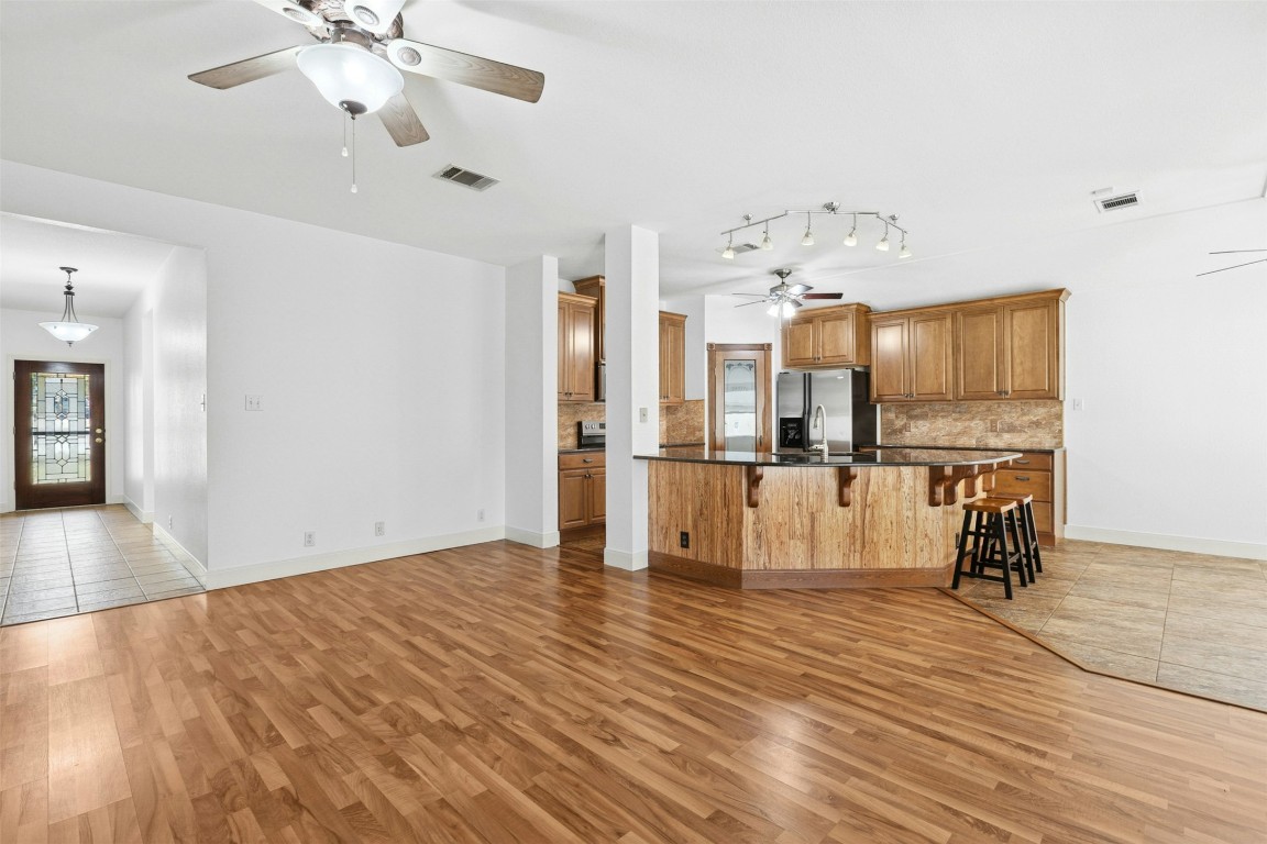 201 Millington Lane Buda, TX 78610 - Photo 5 of 28 Beautiful hardwood flooring in the open family room