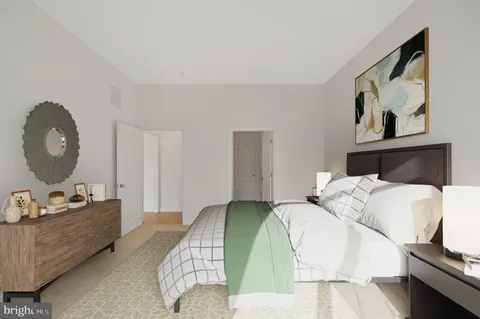 a bedroom with a bed and dresser