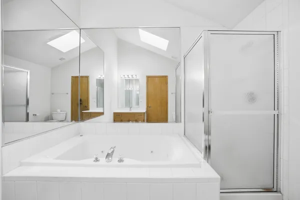 a bathroom with a bathtub and a sink