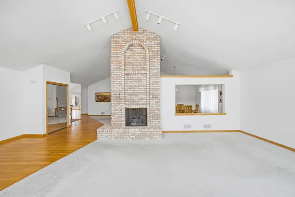 a view of a livingroom with furniture and a fireplace