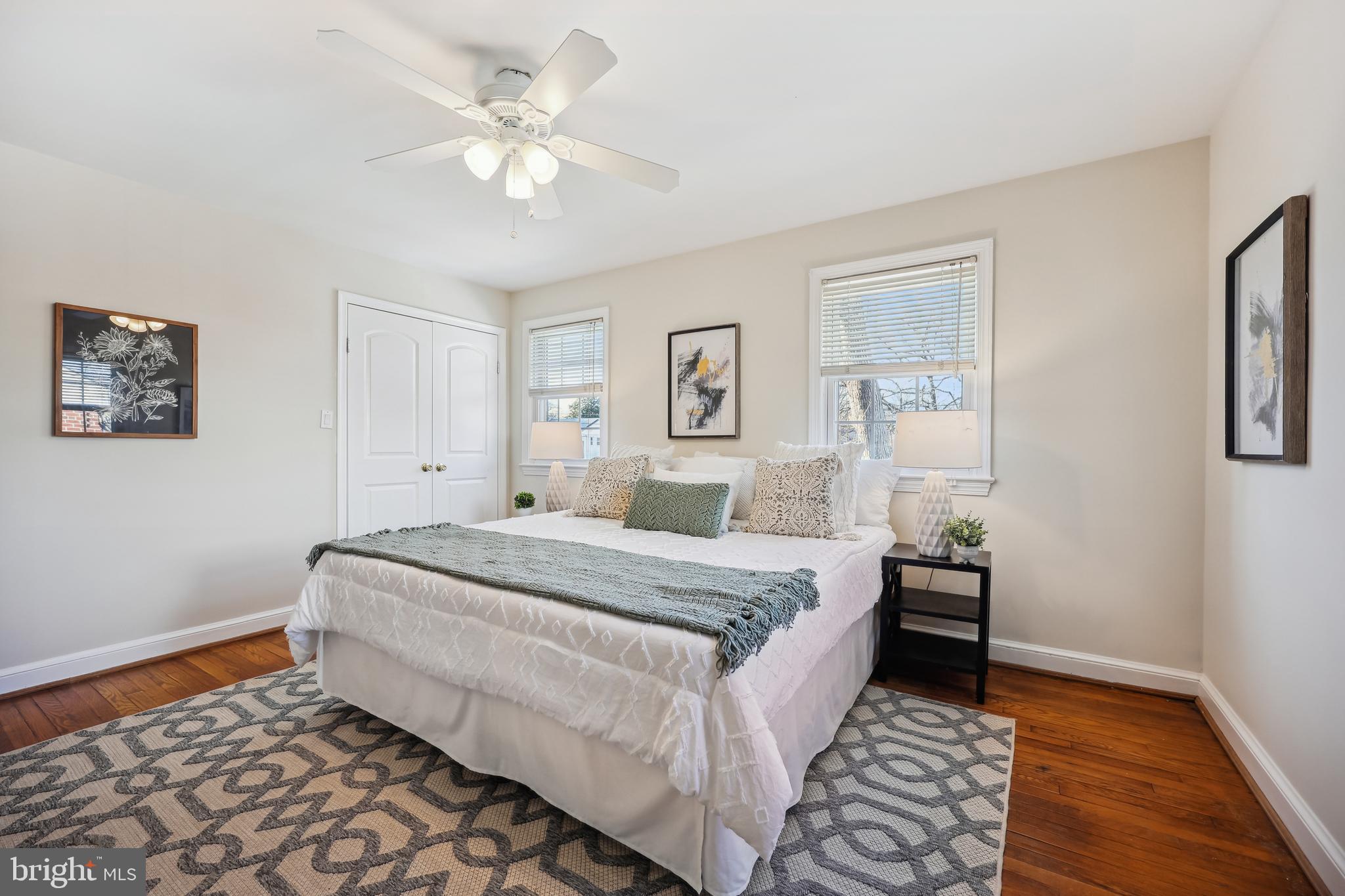 10121 Markham Street Silver Spring, MD 20901 - Photo 28 of 80 a room with a bed and a chandelier