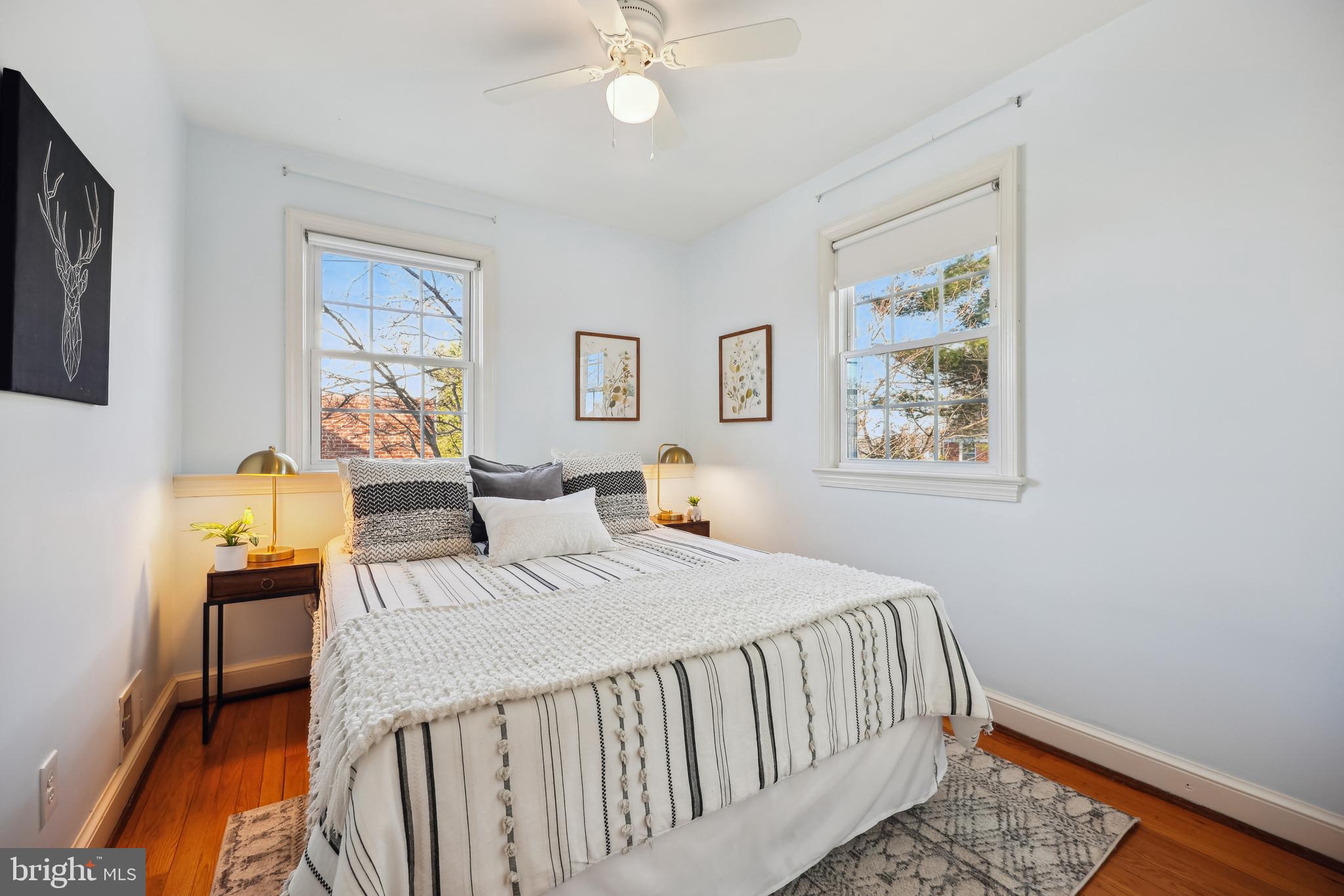 10121 Markham Street Silver Spring, MD 20901 - Photo 36 of 80 a bedroom with a bed and a chandelier