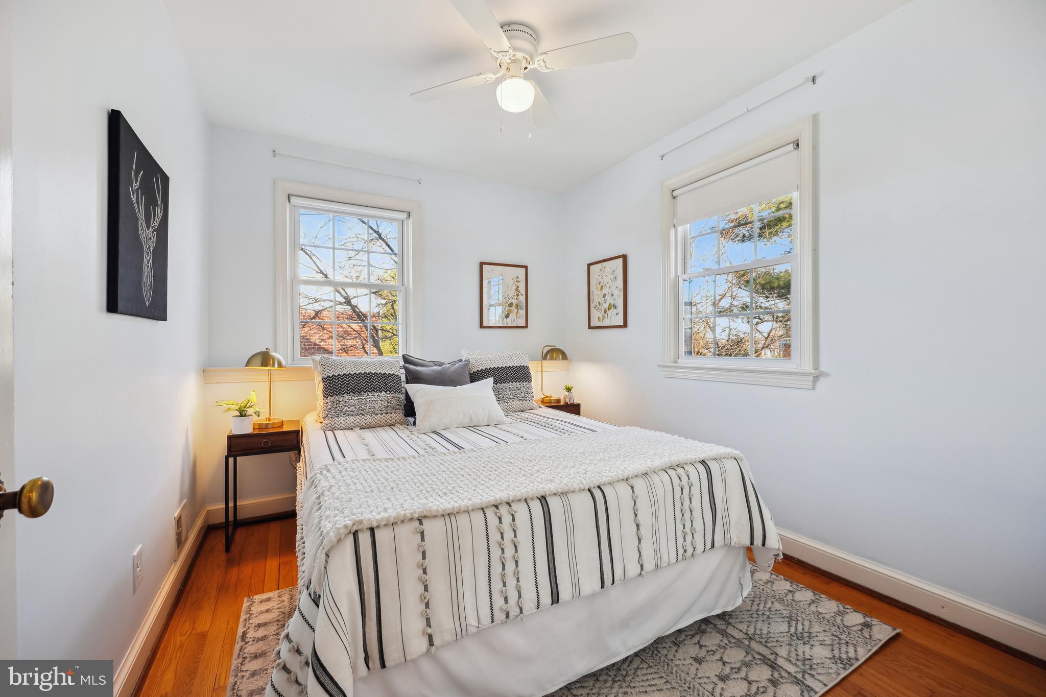 10121 Markham Street Silver Spring, MD 20901 - Photo 37 of 80 a bedroom with a bed and a chandelier