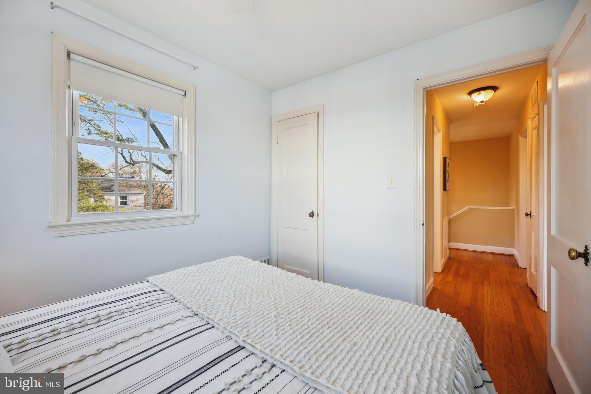 10121 Markham Street Silver Spring, MD 20901 - Photo 40 of 80 a bedroom with a bed and a painting on the wall