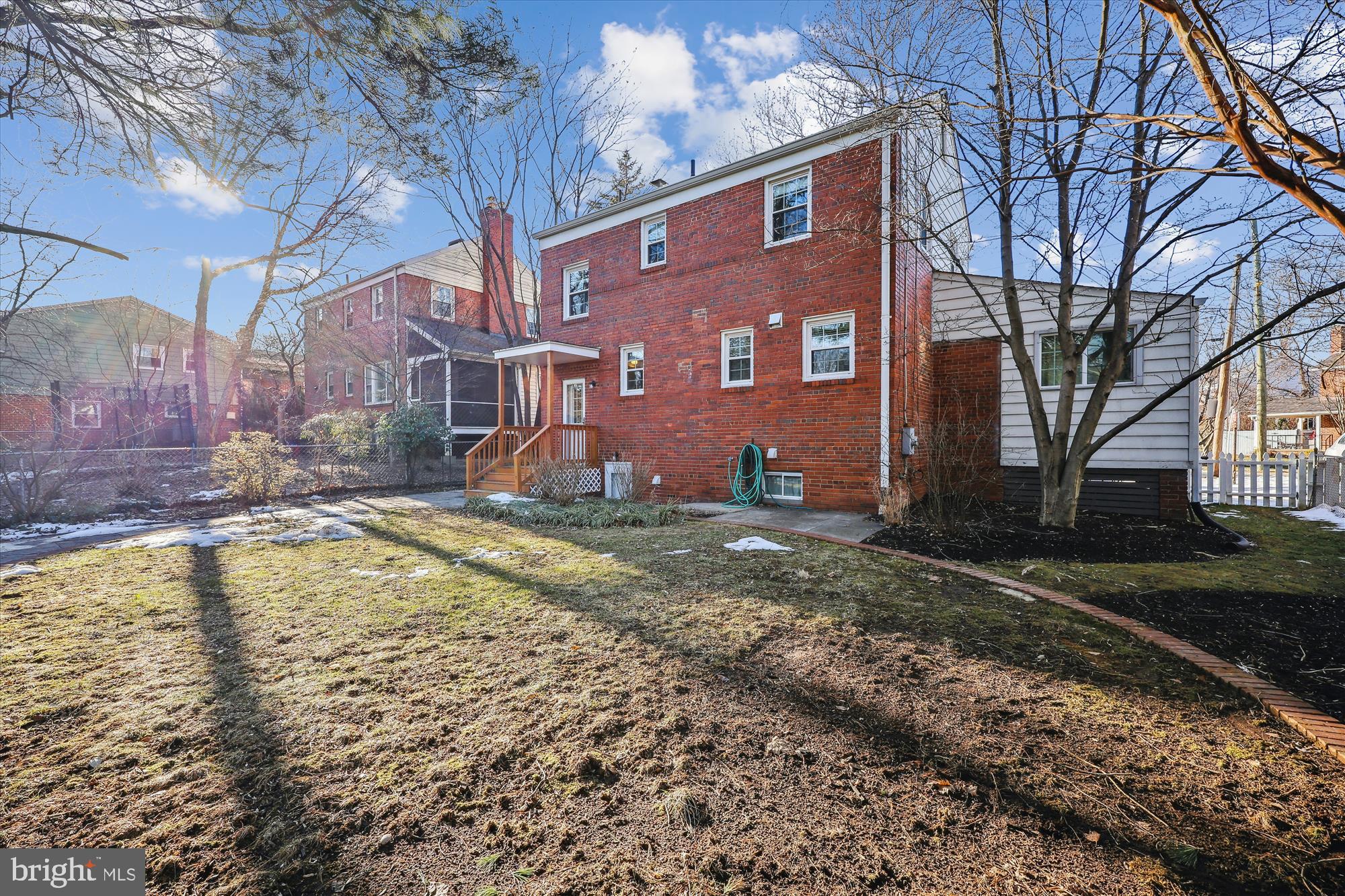 10121 Markham Street Silver Spring, MD 20901 - Photo 53 of 80 a view of a house with a yard covered with snow
