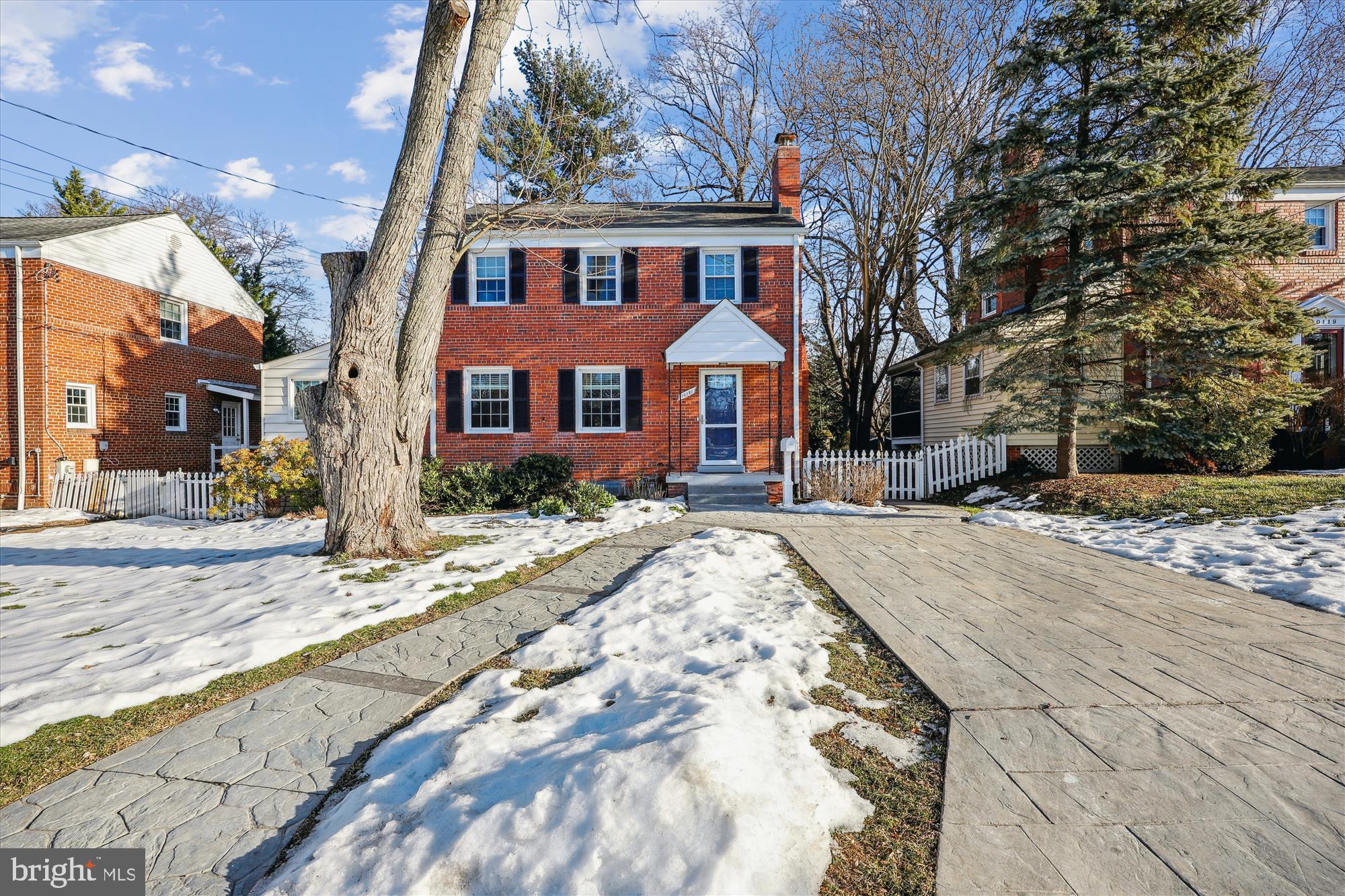 10121 Markham Street Silver Spring, MD 20901 - Photo 55 of 80 a front view of a house with a yard