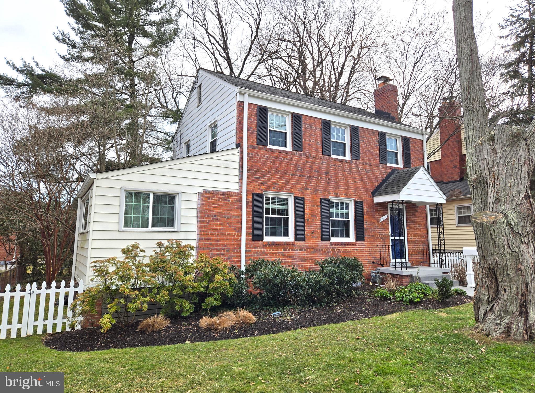 10121 Markham Street Silver Spring, MD 20901 - Photo 58 of 80 a front view of a house with a yard