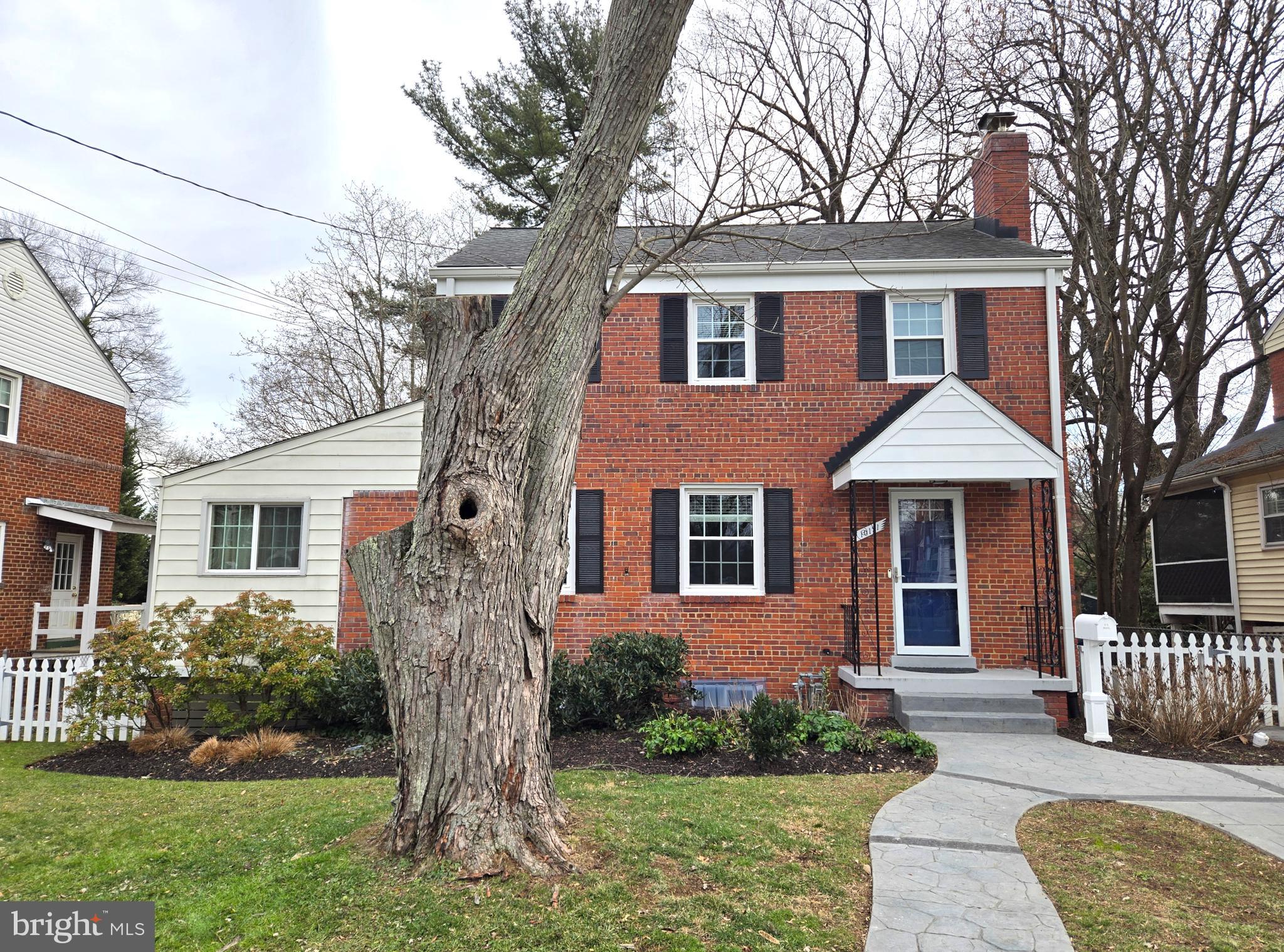 10121 Markham Street Silver Spring, MD 20901 - Photo 59 of 80 front view of a house with a yard