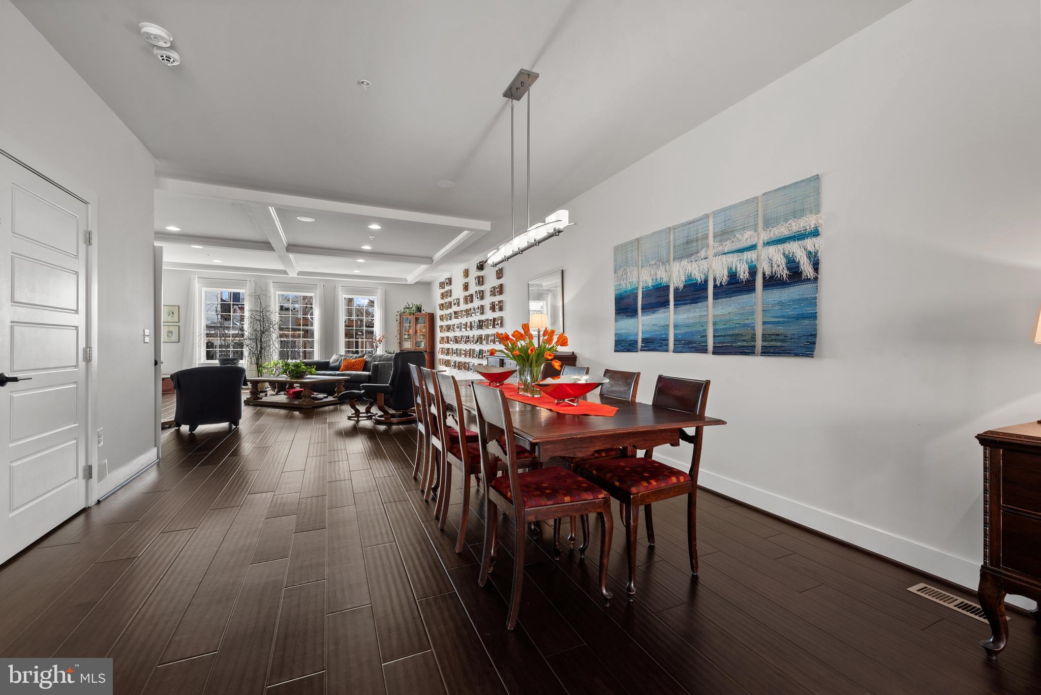 922 South Streeper Street Baltimore, MD 21224 - Photo 11 of 33 a living room with furniture a dining table and a potted plant