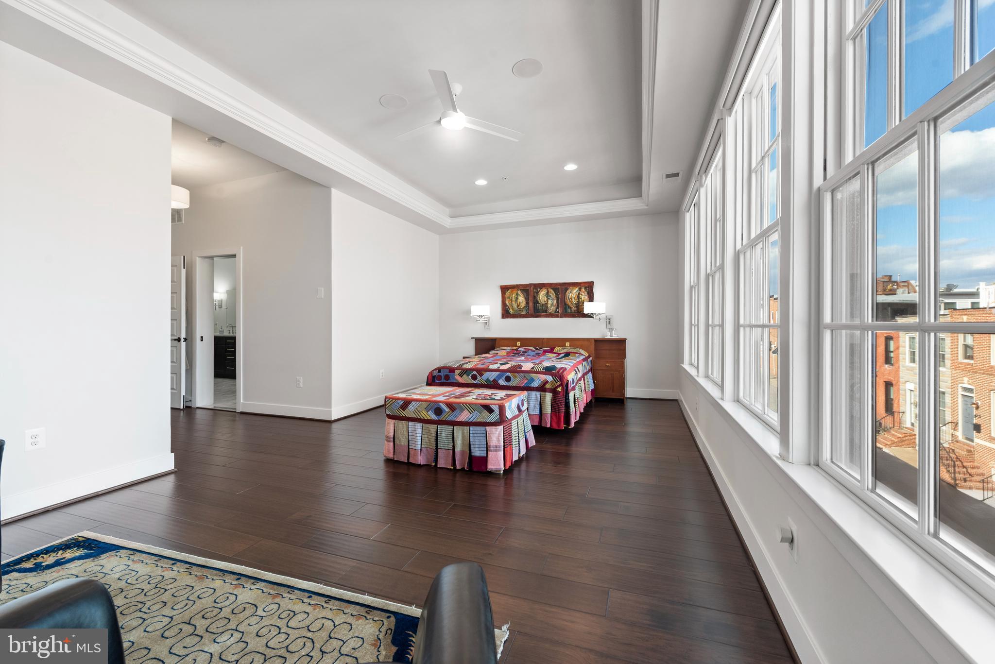 922 South Streeper Street Baltimore, MD 21224 - Photo 14 of 33 a hallway with a book shelf and wooden floor